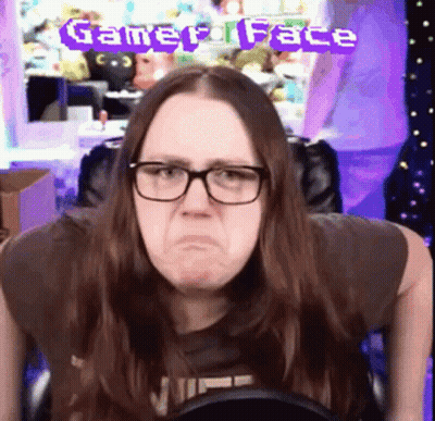 Woman With Glasses Making Funny Face In Front Of Gamer Face Banner GIF