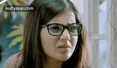 Woman With Glasses Making Funny Face GIF