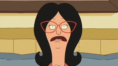 Woman With Glasses Making Funny Face GIF
