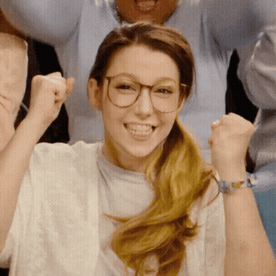 Woman With Glasses Raising Fist