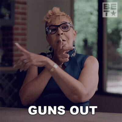 Woman With Glasses Says Guns Out GIF