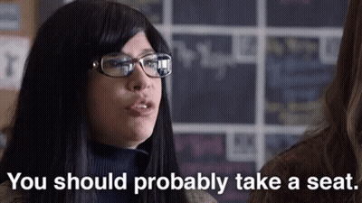 Woman With Glasses Says You Should Probably Take Seat GIF