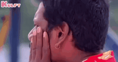 Woman With Glasses Sitting On Couch Looking At Camera GIF