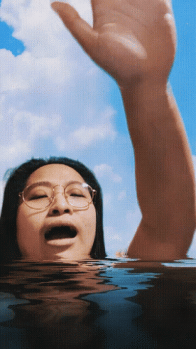 Woman With Glasses Swimming GIF