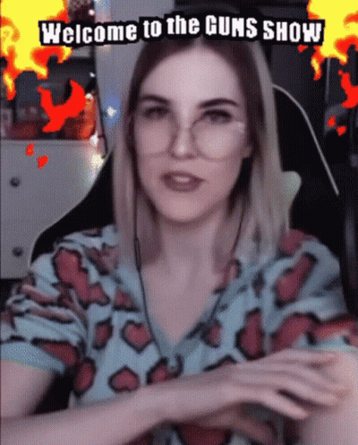 Woman With Glasses Watching Welcome To The Guns Show GIF