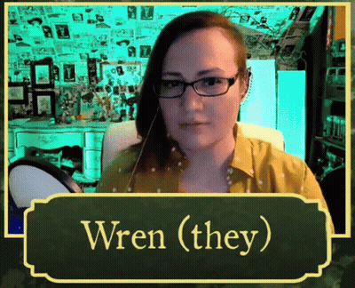 Woman With Glasses Yellow Shirt Says Wren (They) GIF