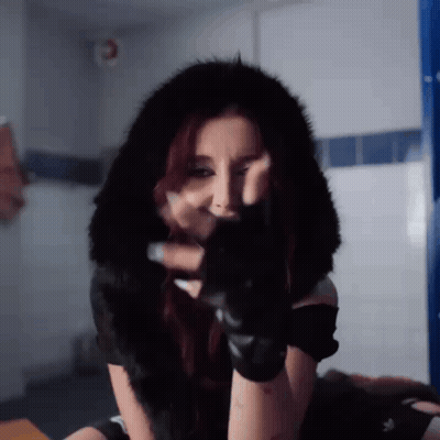 Woman With Gloves And Fur Hood Making Face GIF