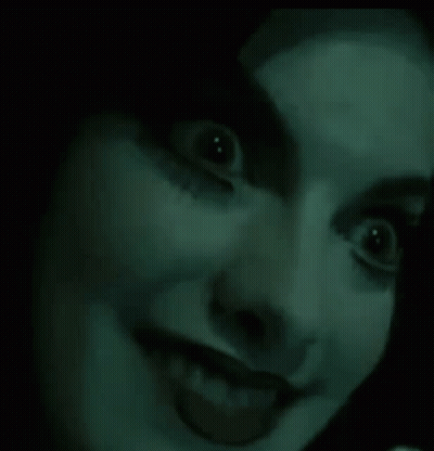 Woman With Glowing Eyes And Tongue Out GIF