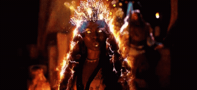 Woman With Gold Crown And Earrings Dancing GIF