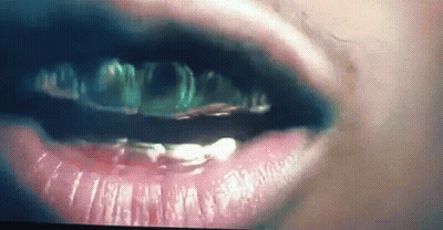 Woman With Gold Teeth And Black Lipstick GIF
