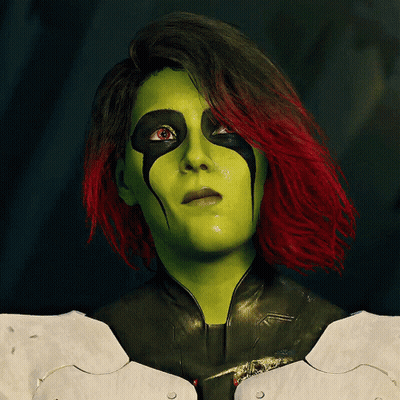 Woman With Green And Red Hair In Costume GIF