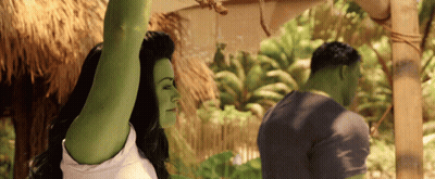 Woman With Green Arms Next To Man GIF