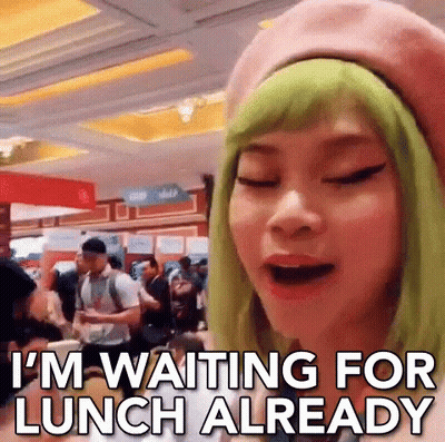Woman With Green Hair And Pink Beret Waiting For Lunch GIF