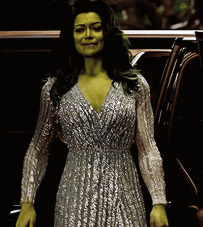 Woman With Green Hair And Silver Dress Standing Next To Car GIF