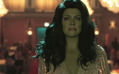 Woman With Green Hair And Silver Top GIF