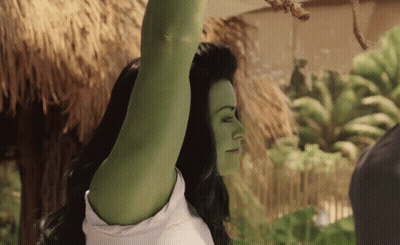 Woman With Green Hair And White Shirt Arm Up GIF
