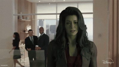 Woman With Green Hair By Window With Disney Logo GIF