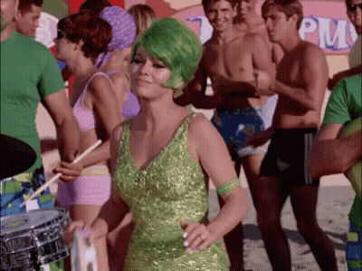 Woman With Green Hair Dancing In Front Of PM Sign GIF