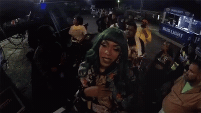 Woman With Green Hair In Front Of Food Truck GIF