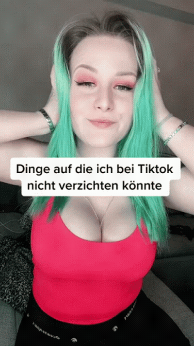 Woman With Green Hair In Red Tank Top Saying Dinge Auf Die Ich Bei Tiktok Nicht Verzichten Könnte GIF