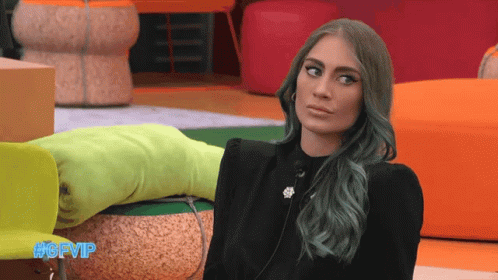 Woman With Green Hair Sitting On Chair GIF