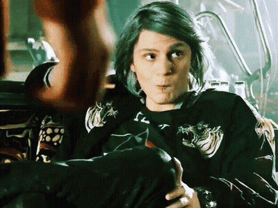 Woman With Green Hair Wearing Black Dragon Shirt GIF
