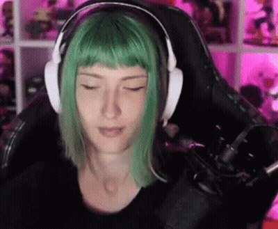 Woman With Green Hair Wearing Headphones And Microphone GIF