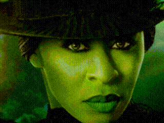 Woman With Green Makeup And Hat GIF