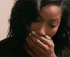 Woman With Green Nail Polish Covering Mouth GIF