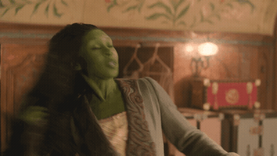 Woman With Green Paint On Face Dancing GIF
