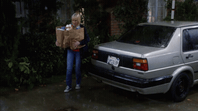 Woman With Groceries By Silver Car Plate SPC1637 GIF