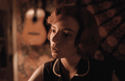 Woman With Guitar Looking At Camera GIF