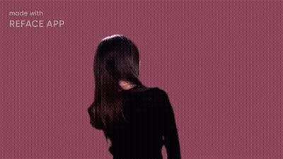 Woman With Hair Blowing In Wind On Pink Background GIF
