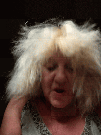 Woman With Hair Blowing In Wind GIF