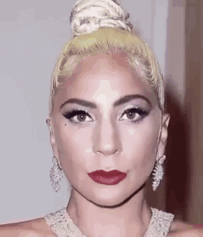 Woman With Hair Bun And Red Lipstick GIF