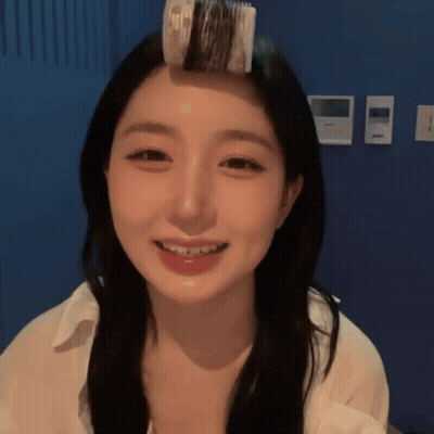Woman With Hair Roller Smiling GIF