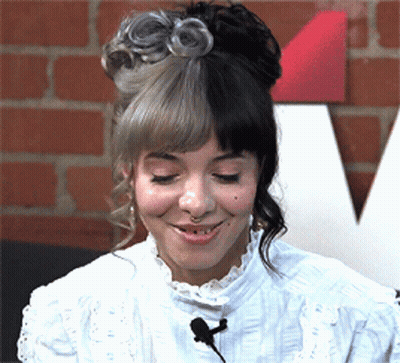 Woman With Half Gray Half Black Hair Smiling GIF