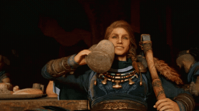 Woman With Hammer Sitting At Table With Food GIF