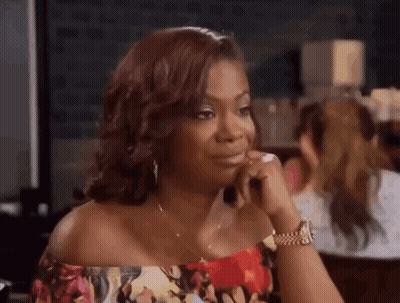 Woman With Hand On Chin And Funny Face GIF