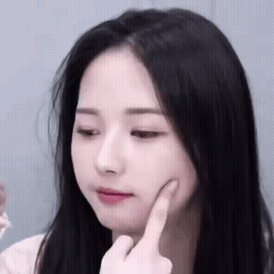 Woman With Hand On Chin Close Up GIF