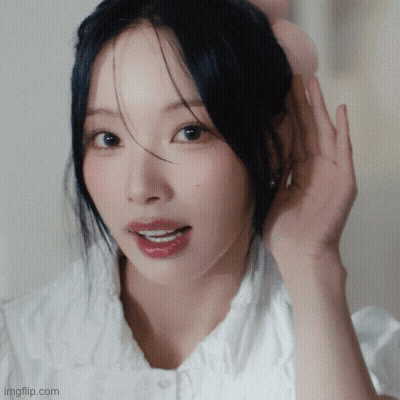 Woman With Hand On Ear Close Up GIF