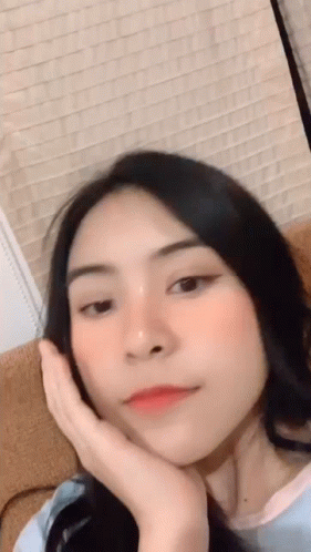 Woman With Hand On Face GIF