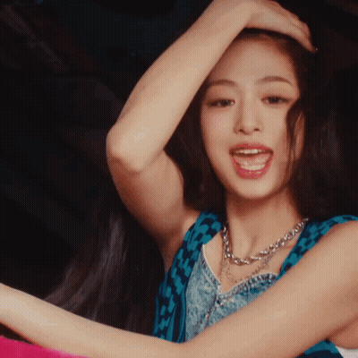 Woman With Hand On Head In Blue Top And Necklace GIF