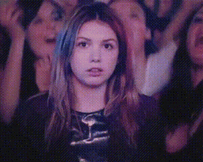 Woman With Hands In Air In Front Of Crowd GIF