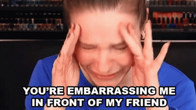Woman With Hands on Head Saying You're Embarrassing Me in Front of My Friend