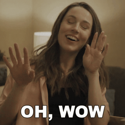 Woman With Hands Up Saying Oh Wow GIF
