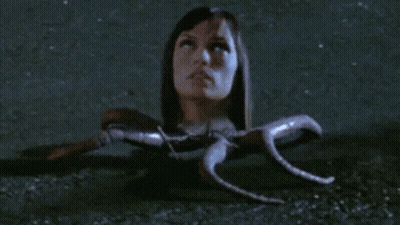 Woman With Head Sticking Out Of Hole GIF