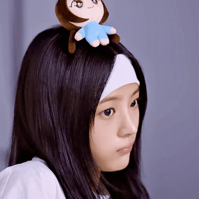 Woman With Headband And Stuffed Animal On Head GIF