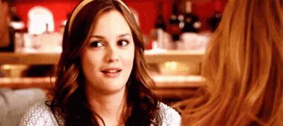 Woman With Headband Sitting With Another Woman GIF