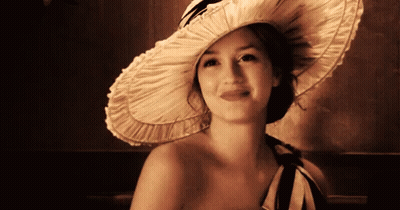 Woman With Headband Smiling In Classroom GIF